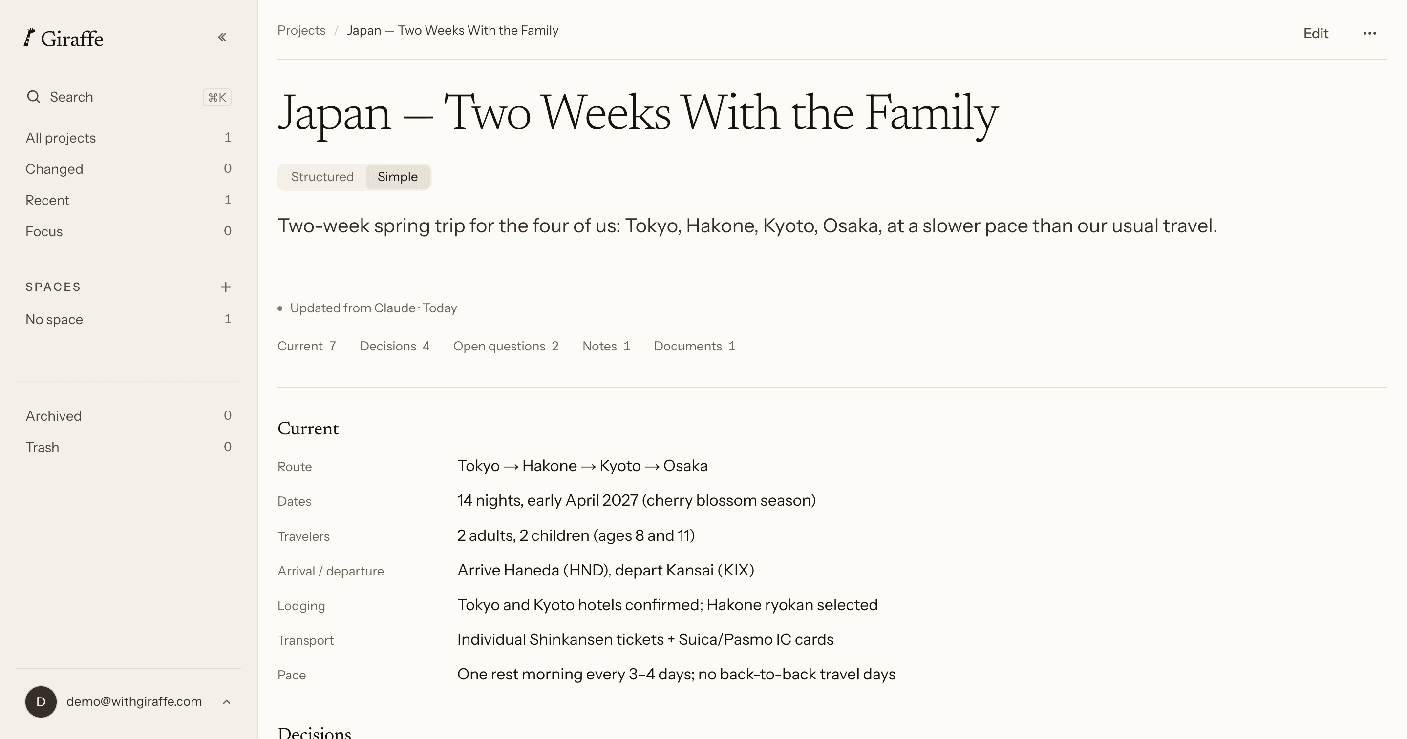 The Japan — Two Weeks With the Family project open in Giraffe on the web in Simple view: one flowing description, then a plain Current heading over seven unboxed rows (route, dates, travelers, arrival and departure, lodging, transport, pace), with no change list or History link anywhere on the page